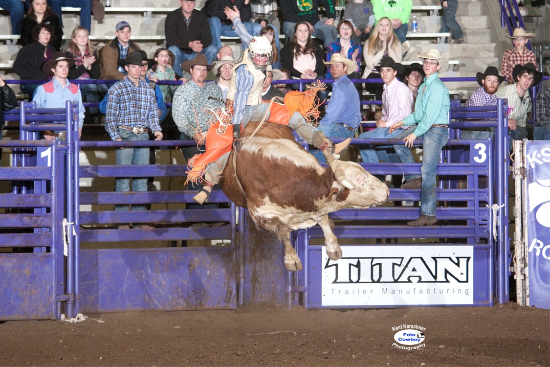 Matt May of Sydney, Arkansas, shows his championship form on a bull from Hall Rodeo LLC, Bentonville, Arkansas, during the 2014 K-State Invitational Bull Bash, sponsored by the Kansas State University Rodeo Club, recently at Manhattan. May marked 84 points on his first bull, had 85 points in the second round, to win the average, even after failing to make the buzzer on his short go-round mount. (Photo generous courtesy of FotoCowboy® Kent Kerschner/Kent Kerschner Photography.)
