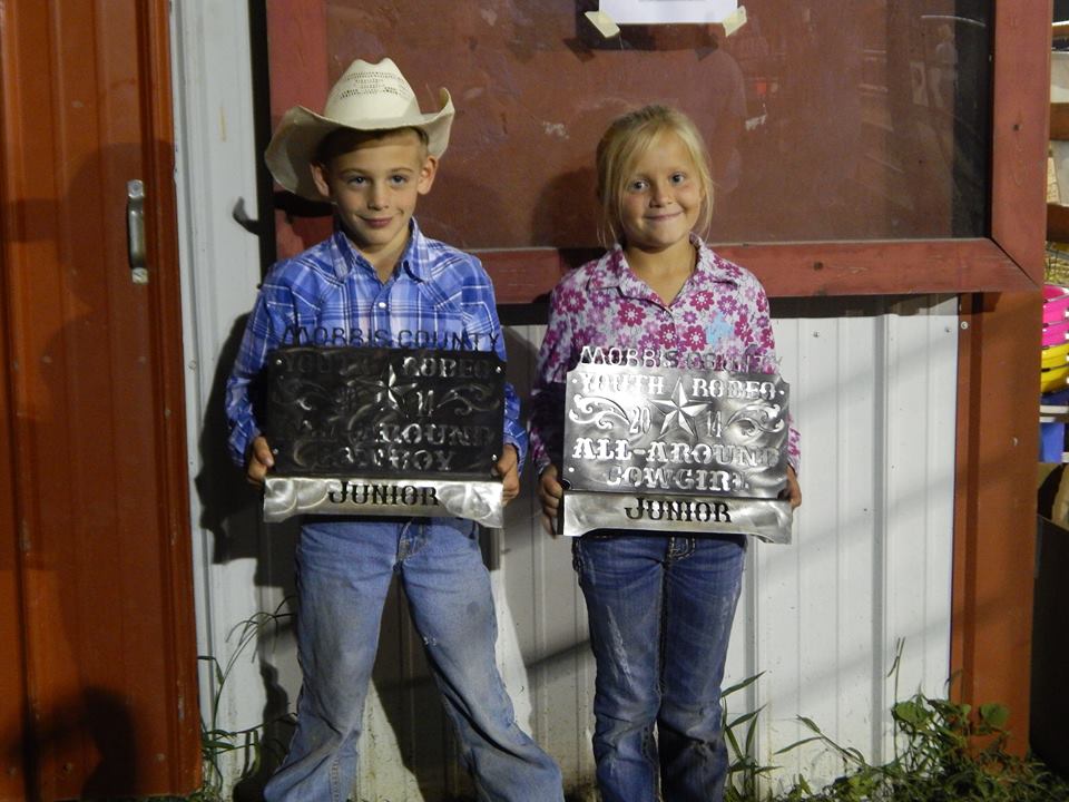 Dexton Hoelting, Olpe, and Taylor Gustafson, Junction City, were named all-around cowboy and cowgirl, respectively, in the junior division of the Morris County Youth Rodeo Saturday night at Council Grove. (Photo by Amy Allen.)