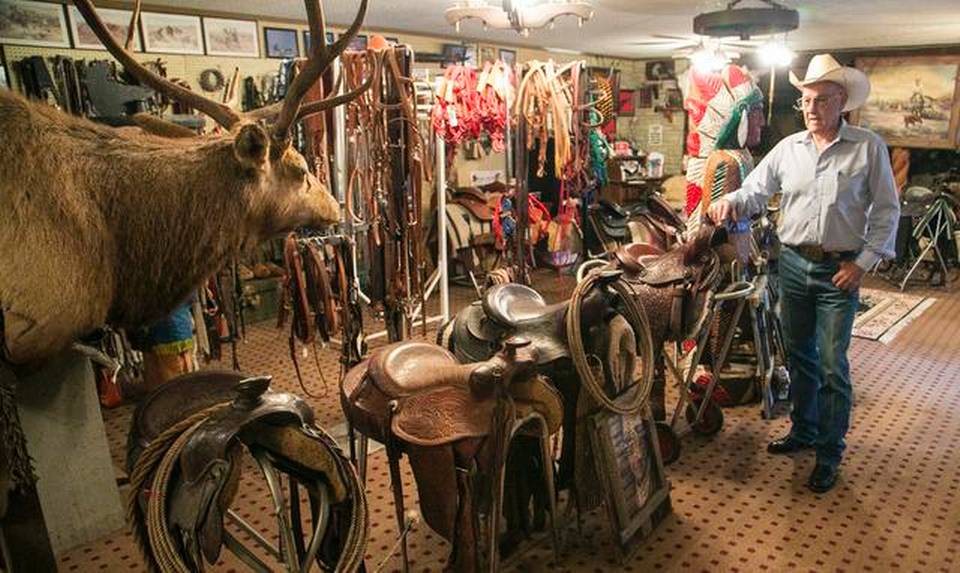 Recent inductee into the Kansas Cowboy Hall of Fame in the rodeo cowboy category, Bud Sankey a vast collection of saddle and tack at his Rose Hill ranch. (Photo by Mike Hutmacher/The Wichita Eagle.)