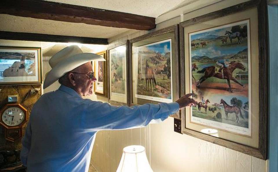 Walls of Bud Sankey's Rose Hill ranch home are covered with horse pictures and Western art work representing the cowboy life lived by the recent Kansas Cowboy Hall of Fame inductee. (Photo by Mike Hutmacher/The Wichita Eagle.)