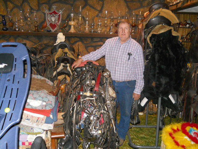 Silver parade saddles including some from the famous maker Ted Flowers as well as white Hereford saddles are included in Stan Seuser’s Western mementos as well as kerosene lamps, several more than a century old.