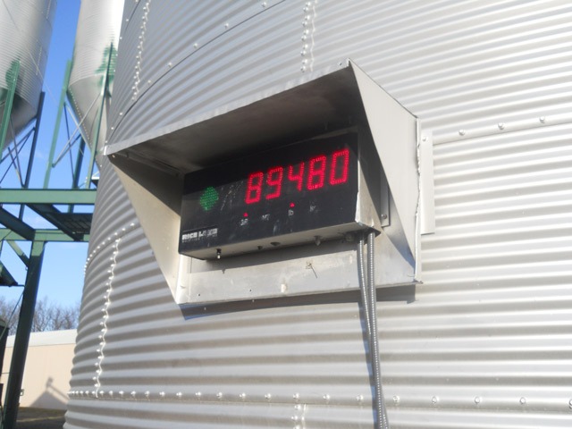 Digital scales screen verifies exact weight of truck and trailer filled with soybeans before it leaves Haselwood Farms, Inc., at Berryton for commercial shipment to terminal market. Although, payment is received on end weight, Bob Haselwood knows the exact pounds of grain leaving his farm.