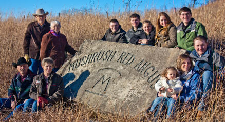 As verified in this portrait when honored last year as “Stockmen of the Year,” Mushrush Red Angus is a family operation in the Flint Hills of Kansas, headquartered at Elmdale. Bob and Oma Lou Mushrush, founders, are with son, Joe and wife Connie; children, Daniel, Casey and wife Ericka, Cole, Laura, Chris, Madelyn, Daniel and wife Christine, their children, Sadie and Isabella.