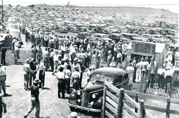 It was a sign of the times, undeniable by the transportation driven by rodeo spectators from throughout the Midwest to attend the Flint Hills Rodeo at Strong City in the mid-1940s. This year’s action features evening performances, June 4-5-6.