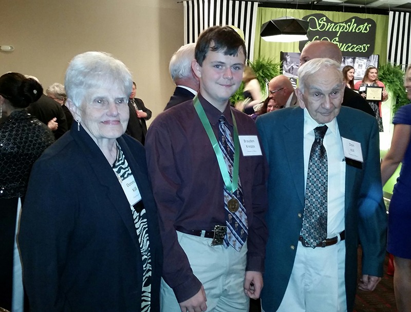 Brayden Krepps, Cambridge, was honored as the State 4-H Horse Award winner at the Emerald Circle Banquet and received congratulations from Don and Donna Kill, longtime sponsors of the award in Kansas.