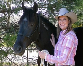 Cindy Branham at The Rockin RC in Topeka is with Joshua, the first Mustang she developed from a wild untrained animal into a submissive horse desiring to have a trusting, working and loving relationship with humans.