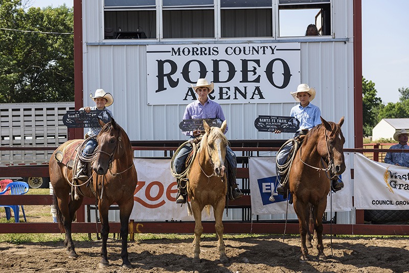 First place team in the Junior Ranch Rodeo, for cowboys and cowgirls 13 and under, in conjunction with the Working Ranch Cowboys Association competition at Council Grove went to the Diamond E Ranch of Redfield represented by brothers Bryce, Colt and Trent Eck. (Photo by Brian Schoenfish.)