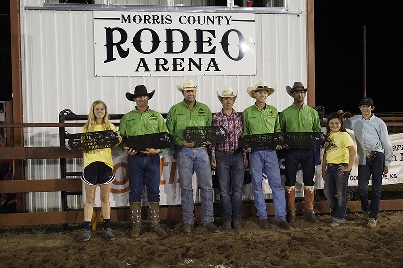 Lonesome Pine Ranch of Cedar Point in Chase County collected first place team honors in the 29th annual Working Ranch Cowboys Association Ranch Rodeo sponsored by the Morris County Youth Rodeo Association Fourth of July weekend at Council Grove. Friends and family posed with the ranch team composed of Bud Higgs, Frank Higgs, Makenzie Higgs, Troy Higgs, Travis Duncan and Chris Potter. (Photo by Bruce Hogle.)
