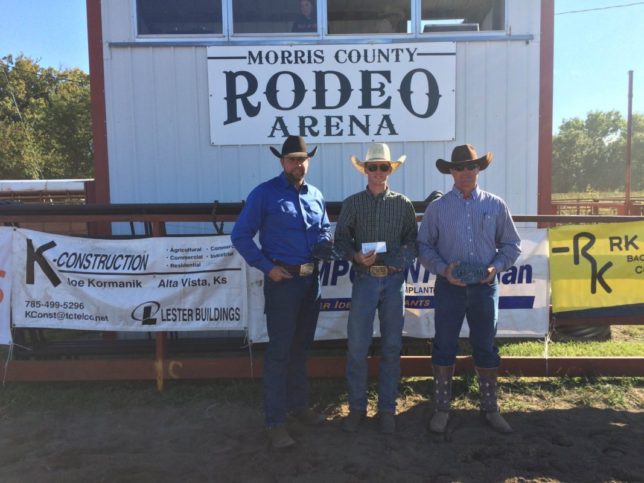 The Lonesome Pine Ranch from Cedar Point won the Fall Invitational Ranch Rodeo hosted by the Morris County Youth Rodeo Association at Council Grove. Travis Duncan, Troy Higgs and Bud Higgs are shown with their awards, while Chris Potter was the fourth member of the team. (Photo by Lisa Wainwright.)
