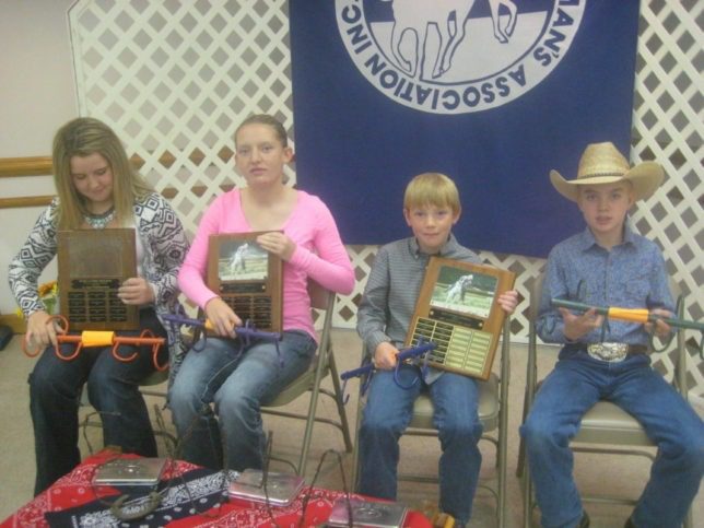At the recent Eastern Kansas Horseman’s Association (EKHA) yearend awards banquet in Clay Center, Shai Zenger and Tori Zabokrtsky received the Girl’s Sportsmanship, and  Most Improved Girl Rider awards, respectively, while Tacoma Augustine and Jayden Patry, were presented the Most Improved Boy Rider, and Boy’s Sportsmanship awards, respectively. The special awards are presented in memory of Rosie Clymer, who was instrumental in forming the EKHA 52 years ago, and was a longtime participant and leader. (Photo by Shirley McDonald.)