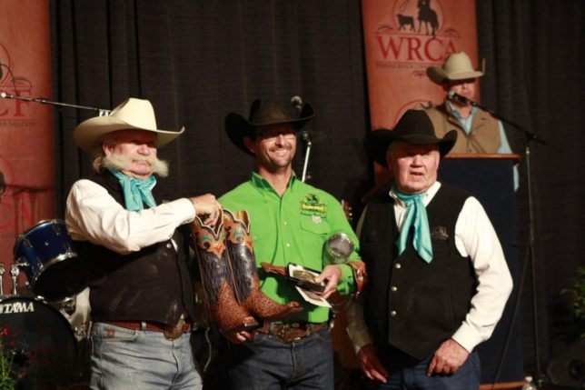With officials of the Working Ranch Cowboys Association, the Lonesome Pine Ranch team from Cedar Point in Chase County all matched up in green shirts collected honors as winner out of 23 teams at the World Championship Ranch Rodeo in Amarillo, Texas. They’re Bud Higgs, Chris Potter, Troy Higgs, Makenzie Higgs, Frank Higgs (his green shirt was in the washing machine) and Travis Duncan. (Photo courtesy of the Working Ranch Cowboys Association.)