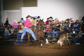 Landon Koehn, Salina cowboy, shows his championship style winning calf roping competition in the Kansas High School Rodeo Association. (Photo by Foto Cowboy.) 