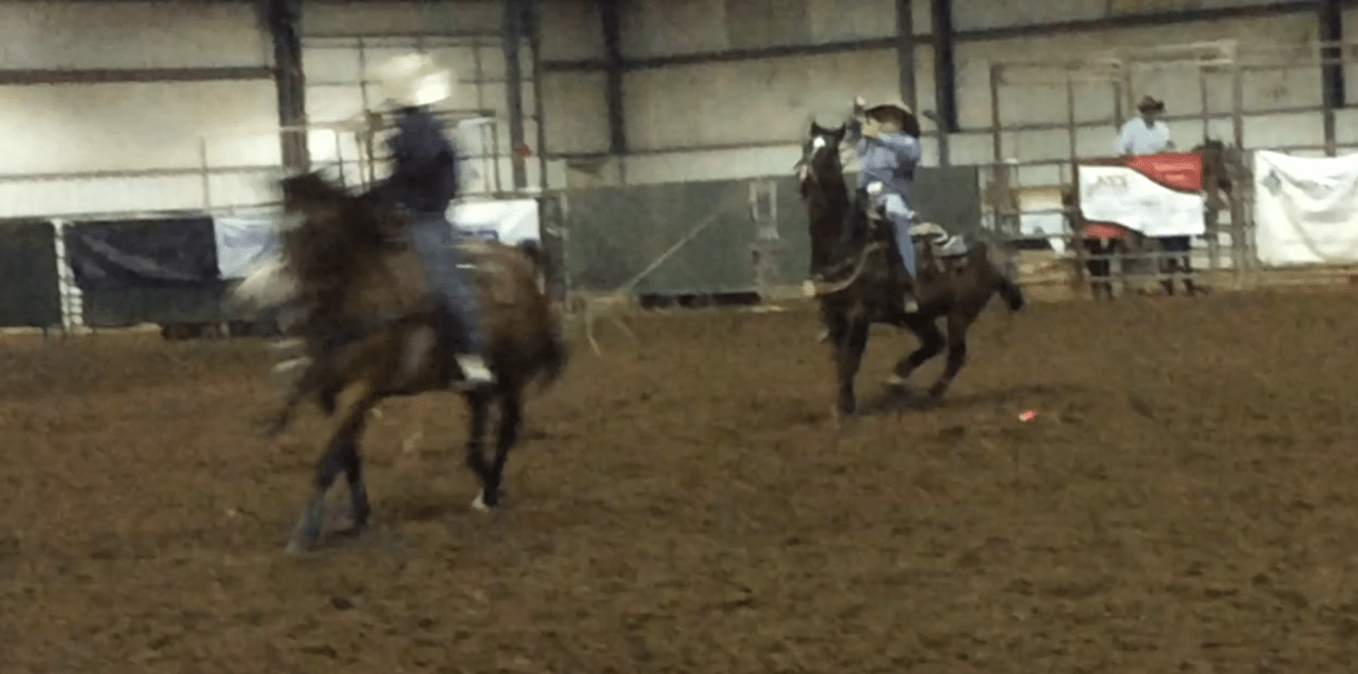 Rhett Murry of Belvue is heeling in a Kansas junior High School Rodeo on his brown gelding called Pecos. 