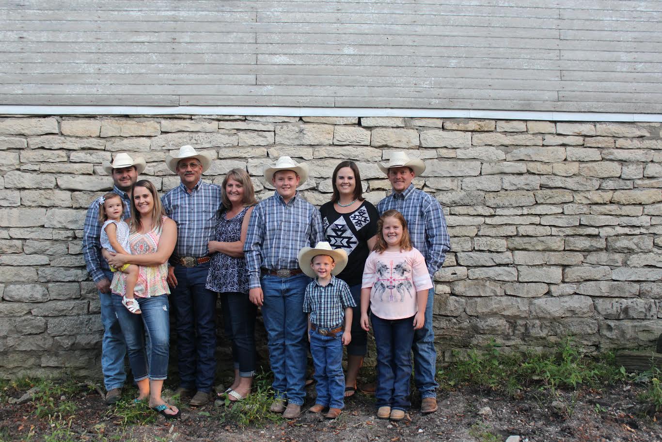 Flint Hills Genetics is a family bucking bull breeding operation at Strong City. The partners include (left to right) Adam, Kelsey and Lakin Spain; Kim, Lana and Wyatt Reyer; and Jenna, Tate, Karlie and Kyle Gibb.
